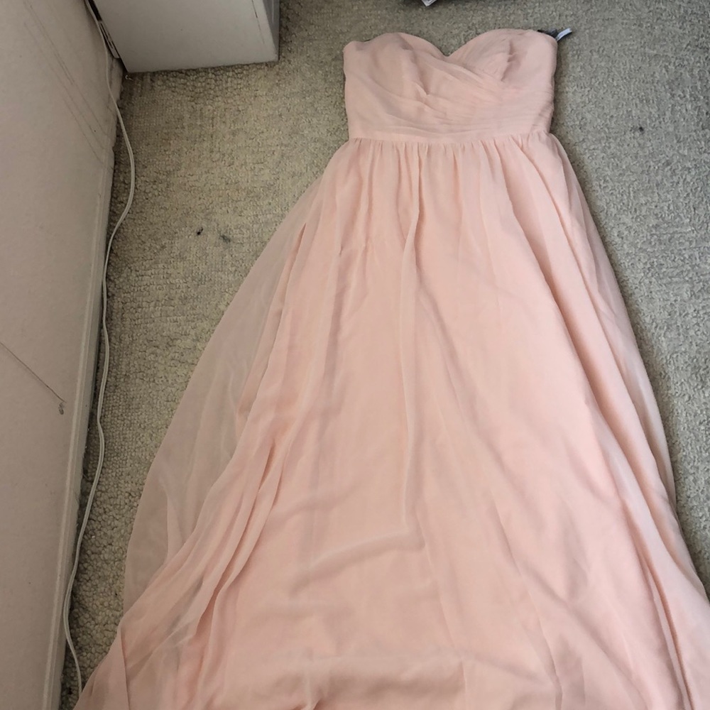 A baby pink strapless fancy silk dress